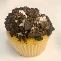 Oreo Cookies & Cream Cupcake · A vanilla cupcake, with buttercream frosting, dipped generously into real Oreo cookie crumbles