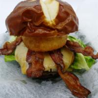 Pretzel Burger Frenzy · Pretzel bun, Xenos burger, double bacon, cheddar and pepper jack, tomato, pickles, lettuce, ...