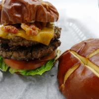 Double Pretzel Burger Frenzy · Pretzel bun, 2 Xenos burger, double bacon, cheddar and pepper jack, tomato, pickles, lettuce...