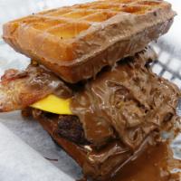 Crunchy Nutella Burger · 2 deep fried waffles with Nutella. Burger, bacon and American cheese.