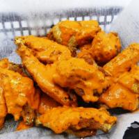 #1. Chipotle Garlic Hot Wings · Wings smothered in Xenos sauce. Mildly spicy.
