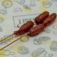 Sausage  · Finely chopped or ground meat mixed with seasoning. 2 pieces.