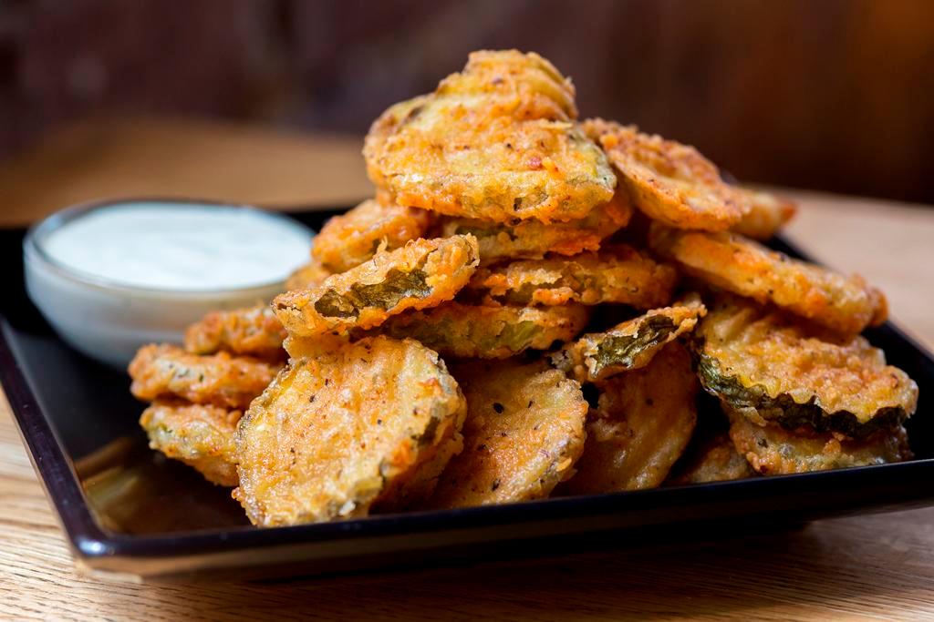 Fried Pickles · Kosher dill pickle chips, lightly breaded and fried, served with buttermilk ranch for dipping