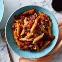 Penne alla Bolognese · Penne and homemade zesty tomato meat sauce.