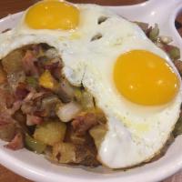Meat Lovers Mega Skillet · 2 eggs with ham, bacon, sausage, onions and bell peppers. Topped with melted Jack and chedda...