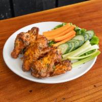 Gator Wings · Tossed in Buffalo, BBQ, teriyaki, or our house made Gator Sauce