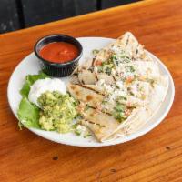 Grilled Quesadilla · Steak, chicken or ground beef with black beans, corn, Monterey Jack cheese. Topped with pico...