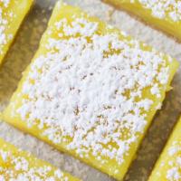 Classic Lemon Bar · Our magical lemon bars featuring a soft butter shortbread crust and a tangy-sweet lemon curd...