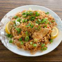 T2. Chicken Pad Thai · Stir-fried Thai noodles with chicken, bean sprouts, scallions, egg and topped with ground pe...