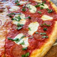 Margherita Pizza · Sauce, fresh mozzarella, basil, and Parmesan cheese.