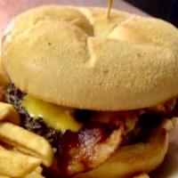 Cowboy Burger · served on a Kaiser roll, with cheddar cheese, bacon and bbq sauce, and a side of fries