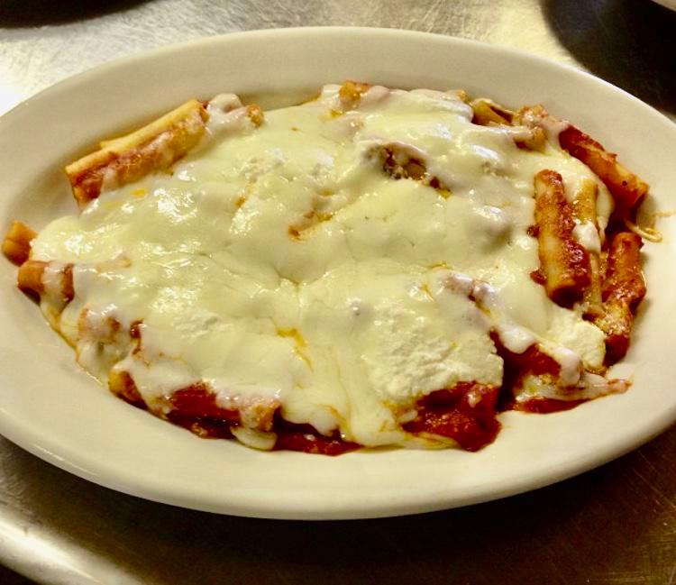 Baked Ziti · Fresh cooked ziti with tomato sauce and ricotta cheese. Topped with melted mozzarella. Served with bread and a house salad.