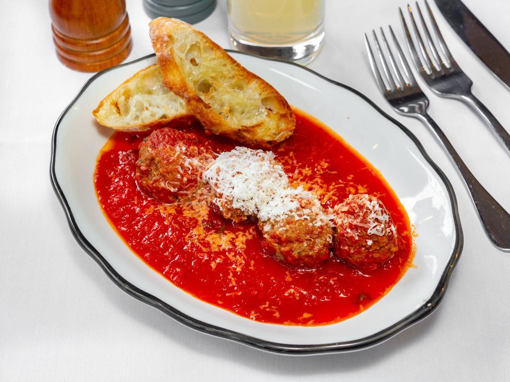 Meatballs · Beef meatballs, tomato sauce, and Parmigiano Reggiano.