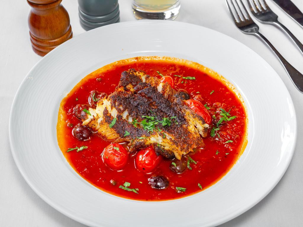 Cod Livornese · Pan seared cod, served on tomato, olives and caper sauce.