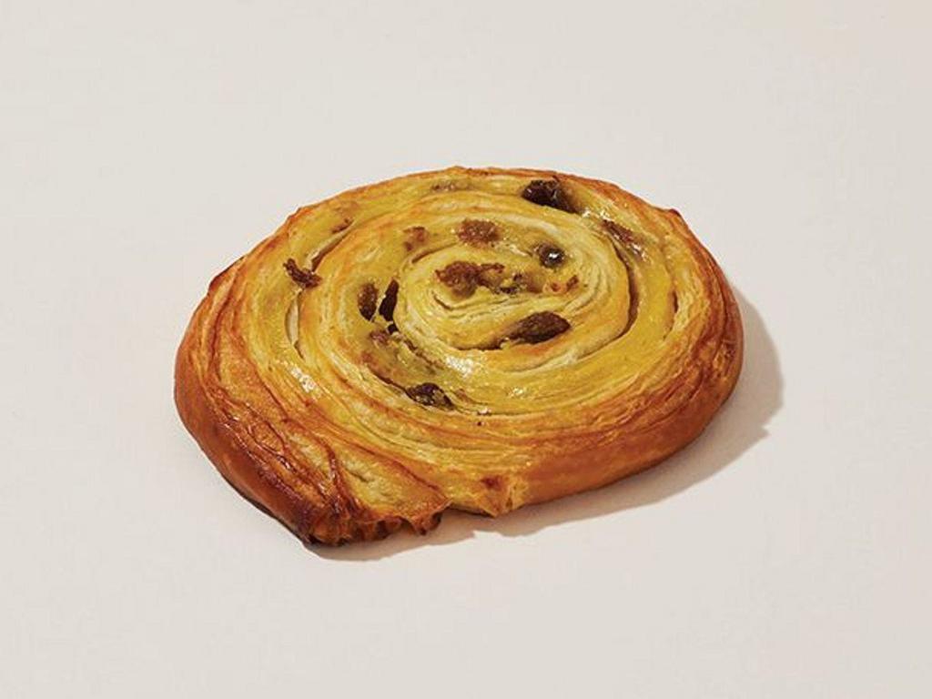 Pain Au Raisin · Buttery, flaky croissant dough with a custard filling and a sprinkle of sultanas baked to perfection.