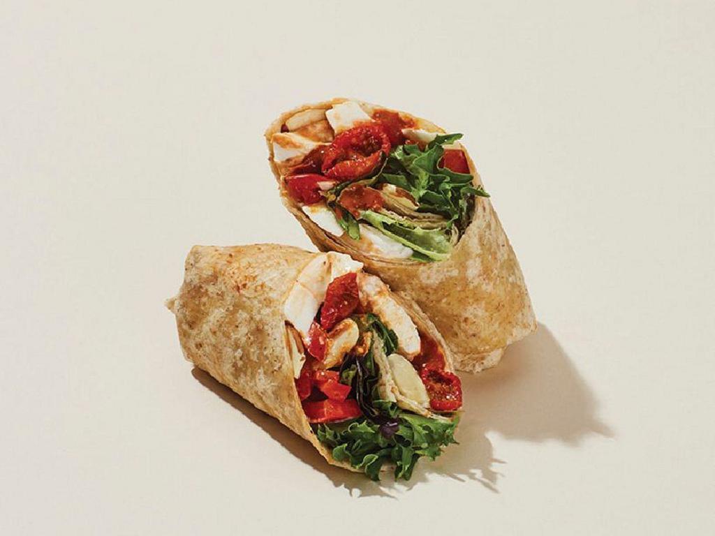 Mozzarella & Red Peppers with Romesco Wrap · Mozzarella, roasted tomatoes, red peppers, sliced almonds, mesclun, and basil with a hearty Romesco sauce, cage-free mayo, and chili salt rolled into a 7-grain wrap.