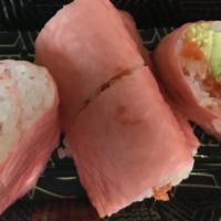 Pink Lady Tempura Roll · Shrimp tempura, spicy tuna, and avocado, wrapped in pink soy paper
