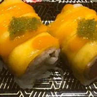Golden Dragon Roll · Spicy tuna, yellowtail and cucumber roll with fresh mango and wasabi tobiko on top.