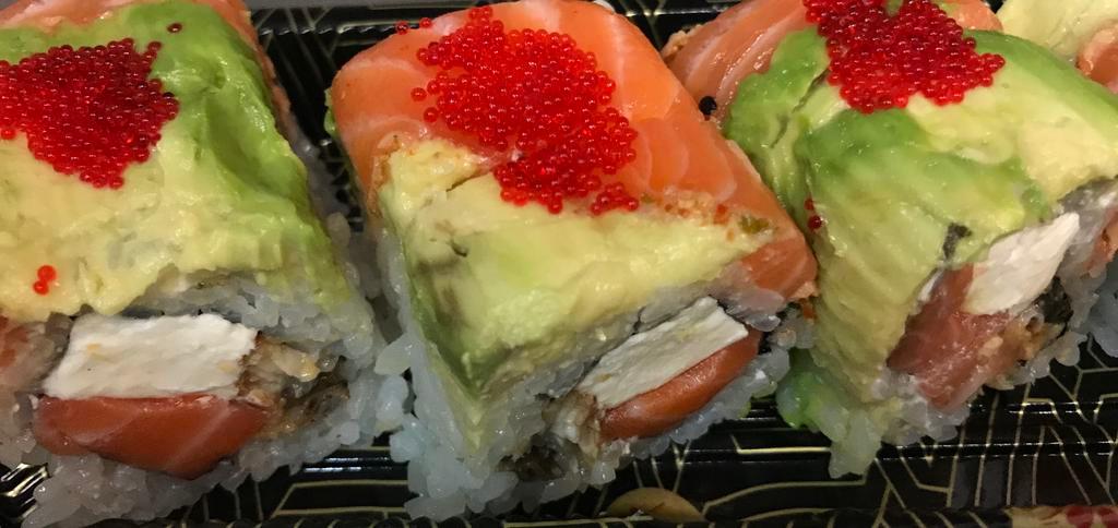 Salmon Lover Roll · Salmon, eel , cream cheese and mayo wrapped with seared salmon, avocado, and tobiko on top