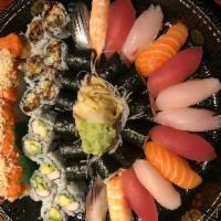 A. Sushi and Roll Platter · 14 pieces sushi and 5 rolls. Includes 4 pieces tuna, 2 pieces salmon, 2 pieces yellowtail, 2...