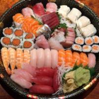 C. Sushi & Sashimi Platter · Sushi includes 4 pieces tuna, 4 pieces yellowtail, 4 pieces salmon, 4 pieces shrimp and 4 pi...