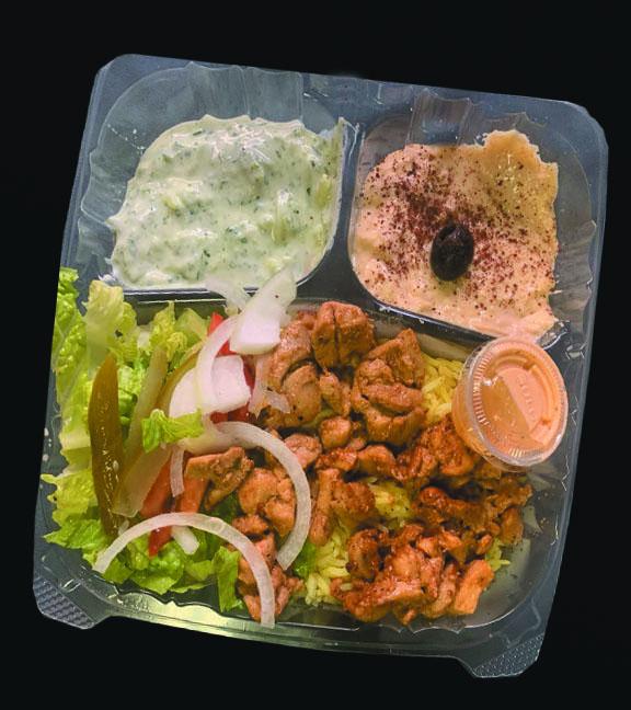 18- Shawarma Plate over rice · shawarma, rice ,tzatziki, dolma,hummus, olive lettuce, tomato, onion, with garlic sauce  on a side