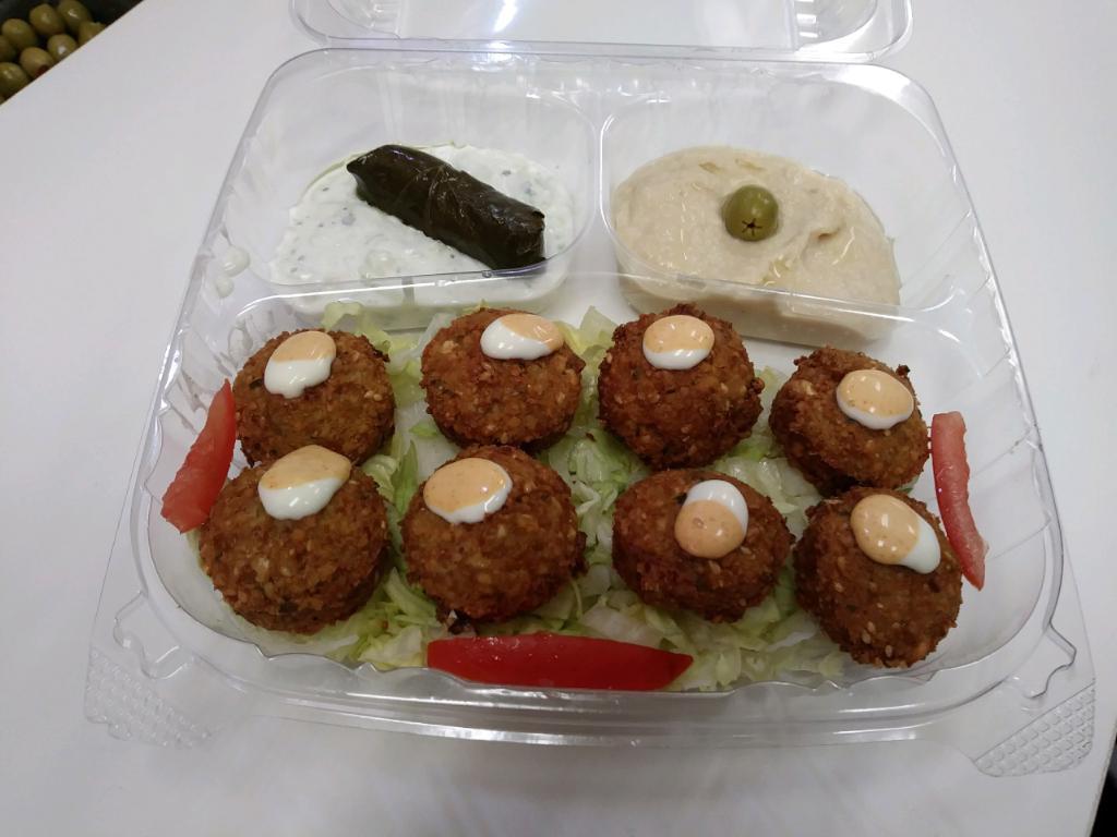 17.Falafel Plate · 6 falafel  , rice tzatziki, dolma, hummus, olive, lettuce, tomato, garlic  sauce on a side