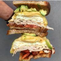 Brain Food Egg Sandwich · Egg whites, turkey, avocado and grilled tomato and Gruyere on whole wheat bread.
