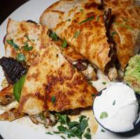 Chicken Quesadilla · Mushrooms, onions, peppers and mozzarella cheese 