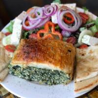 Spinach Pie Deluxe · Greek salad and pita bread.