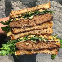 Dirty French Sandwich · Turkey burger, Gruyere, arugula, fig jam, mustard aioli, almonds and bacon on 8-grain with s...