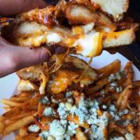 The Dre Stuffed Grilled Cheese · Breaded chicken cutlet, mozzarella and cheddar, caramelized onions, roasted garlic, spicy ma...