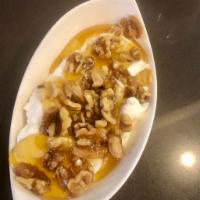 Greek Yogurt · Served with honey and walnuts.