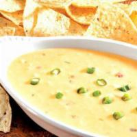 Chili con Queso · Our legendary Mexican-style cheese dip. Add pulled chicken or ground beef and a side of jala...