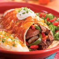 Fajita Steak Burrito · Grilled fajita steak, sauteed peppers and onions, rice, and chili con queso wrapped up in a ...