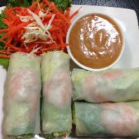 4. Fresh Rolls · green leaves, lettuce, basil and carrots wrapped with rice paper. Served with our chef's spe...