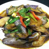 59. Eggplant Delight · Fresh sauteed eggplant with bell peppers, green onions, Thai basil and curry powder with hom...
