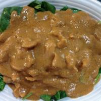 20. Swimming Rama · Choice of protein sauteed over a bed of spinach and topped with peanut sauce. JASMINE RICE I...