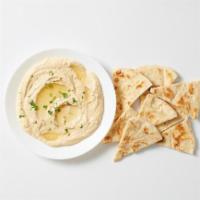 - Hummus Mezze · Chickpeas blended with tahini, lemon juice & garlic. Served with freshly grilled pita bread.