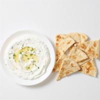 - Tzatziki Mezze · Greek yogurt with cucumbers, dill & garlic. Served with freshly grilled pita bread.
