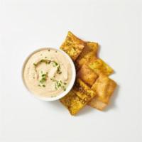 - Pita Chips & Spread · Freshly Baked Pita Chips with Za'atar Seasoning Served With Your Choice Of Spread