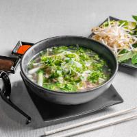 P4. Special Noodle Soup  · Pho dac biet. Noodle soup with round steak, flank, brisket, tendon, and tripe.