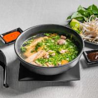 C3. Veggie Noodle Soup  · Pho chay. Vegetarian noodle soup served with fried tofu and herbs.
