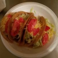 4 corn tacos · Ground beef, lettuce,sour cream and tomatoes