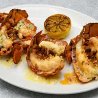 Petite Lobster Tail Trio · 3 Petite Cold Water Lobster Tails Broiled, Sriracha Tomato Butter, Almond Herb Butter, Uni B...