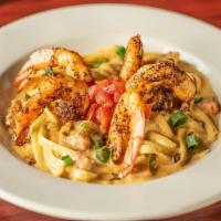 Seafood Pasta · Blackened shrimp, crawfish tails, and andouille sausage in a white wine cream sauce. Served ...
