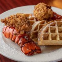 Lobster & Waffles · Two seasoned lobster tails (grilled or fried) severed with hot waffles drizzled with icing a...