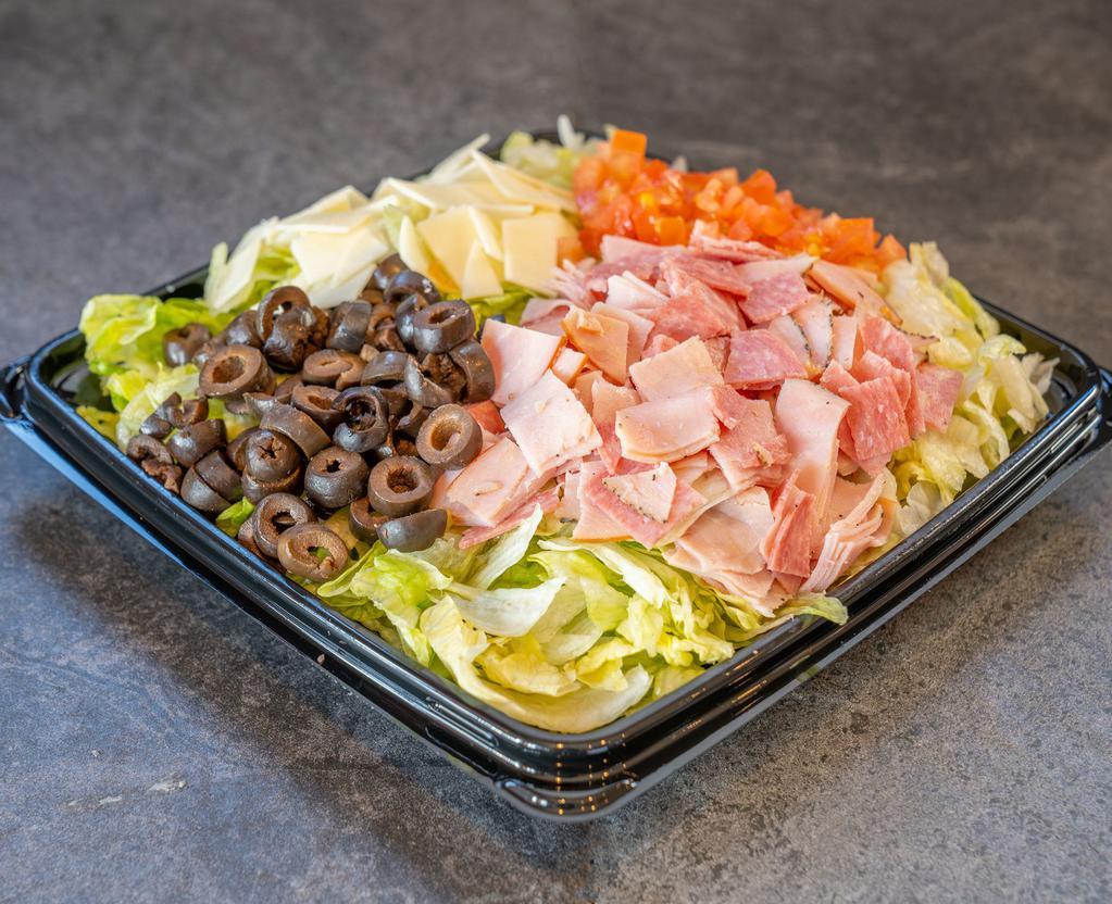 CAP's Chopped Salad · Think our popular Italian sub but on a salad! Salami, capacolla, prosciuttini, provolone cheese, tomatoes, and black olives on a bed of fresh chopped lettuce. Served with red wine vinaigrette. 