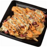 Capastrami Fries · Flat Fries topped with Pastrami, swiss cheese, cole slaw, and Russian dressing.