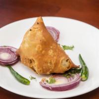 One piece Vegetable Samosa · Deep fried pattie stuffed with mixed veg, beans and nuts spices.